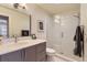Stylish bathroom featuring a modern vanity, framed mirror, and glass-enclosed shower stall at 904 Fieldstone Pl, Highlands Ranch, CO 80126