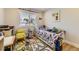 Bright and playful bedroom featuring a fun car themed rug, small bed and toys at 904 Fieldstone Pl, Highlands Ranch, CO 80126