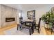 Cozy dining room with a modern fireplace, stylish furniture, and natural light at 904 Fieldstone Pl, Highlands Ranch, CO 80126