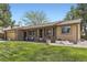 Charming home with a brick facade, well-manicured lawn, and inviting front porch at 904 Fieldstone Pl, Highlands Ranch, CO 80126