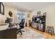 Functional home office with desk, comfortable chair, and built-in shelving for optimal organization at 904 Fieldstone Pl, Highlands Ranch, CO 80126
