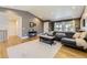 Spacious living room featuring hardwood floors, natural light, and an open layout at 904 Fieldstone Pl, Highlands Ranch, CO 80126