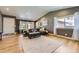 Bright living room featuring hardwood floors, natural light, and a comfortable seating area at 904 Fieldstone Pl, Highlands Ranch, CO 80126