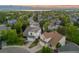 Desirable neighborhood showcases well-maintained homes, mature trees, and scenic mountain views in the distance at 3087 Deer Creek Trl, Highlands Ranch, CO 80129