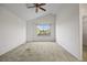 Spacious bedroom with natural light and a glimpse of the neighborhood at 3087 Deer Creek Trl, Highlands Ranch, CO 80129