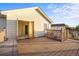 Spacious wooden deck perfect for outdoor entertaining, with an open door to the house at 3087 Deer Creek Trl, Highlands Ranch, CO 80129