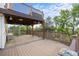 Multi-level deck area with wooden railings and a spiral staircase, offering outdoor space at 3087 Deer Creek Trl, Highlands Ranch, CO 80129