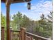 Cozy deck space with views of the surrounding trees and neighborhood at 3087 Deer Creek Trl, Highlands Ranch, CO 80129