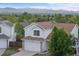 Beautifully maintained two-story home with mature landscaping and a two-car garage provides ample space at 3087 Deer Creek Trl, Highlands Ranch, CO 80129
