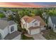 Expansive two-story home boasts a spacious layout, two-car garage, and lovely sunset views at 3087 Deer Creek Trl, Highlands Ranch, CO 80129