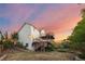 Spacious home featuring multi-level wooden decks, a large yard, and beautiful sky at 3087 Deer Creek Trl, Highlands Ranch, CO 80129