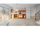 Open concept kitchen featuring wood cabinets, stainless steel appliances and natural light from a sliding glass door at 3087 Deer Creek Trl, Highlands Ranch, CO 80129