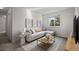 Cozy living room with neutral tones, stylish decor, and a view of the neighborhood at 3087 Deer Creek Trl, Highlands Ranch, CO 80129