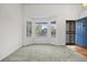 Bright living room with bay window and steel security door at 3087 Deer Creek Trl, Highlands Ranch, CO 80129