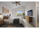 Stylishly furnished main bedroom with vaulted ceiling, neutral walls, and large window for ample natural light at 3087 Deer Creek Trl, Highlands Ranch, CO 80129