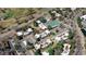 Aerial view of a community with tennis courts, swimming pool and mature trees next to a golf course at 2525 S Dayton Way # 2209, Denver, CO 80231