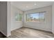 Cozy bedroom with ample natural light streaming through the windows, complemented by sleek gray flooring at 2525 S Dayton Way # 2209, Denver, CO 80231