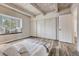 Bedroom boasts a window seat, wood floors, neutral colors and large closet, perfect for relaxation and storage at 2525 S Dayton Way # 2209, Denver, CO 80231