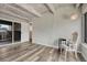 Relaxing room featuring neutral walls, wood floors, exposed beam ceiling, and ample natural light at 2525 S Dayton Way # 2209, Denver, CO 80231