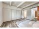 A well-lit bedroom showcases wood floors, a large closet, and a neutral palette, creating a serene atmosphere at 2525 S Dayton Way # 2209, Denver, CO 80231