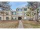 Front view of the apartment complex with walkway at 2525 S Dayton Way # 2209, Denver, CO 80231