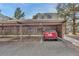 Red car parked under a carport at 2525 S Dayton Way # 2209, Denver, CO 80231