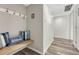 Inviting entryway with wood bench, storage hooks, accent pillows, and modern flooring for a welcoming arrival at 2525 S Dayton Way # 2209, Denver, CO 80231