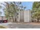 Exterior view of the apartment complex surrounded by trees at 2525 S Dayton Way # 2209, Denver, CO 80231