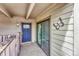 Welcome to this home featuring a secure front door with a glass pane window and a neutral-toned welcome mat at 2525 S Dayton Way # 2209, Denver, CO 80231