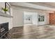 Spacious living room with sleek flooring, modern fireplace, and bright, natural light. Ready to move in! at 2525 S Dayton Way # 2209, Denver, CO 80231