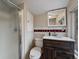Traditional bathroom featuring a vanity with modern sink and a stand-up shower at 26349 Pleasant Park Rd, Conifer, CO 80433