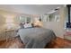 Cozy bedroom with a comfortable queen size bed and wood floors at 26349 Pleasant Park Rd, Conifer, CO 80433