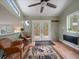 Bright room with rustic rug, and double doors leading to an outdoor space at 26349 Pleasant Park Rd, Conifer, CO 80433