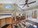 Inviting living room with a view, features hardwood floors, and clerestory windows for natural light at 26349 Pleasant Park Rd, Conifer, CO 80433