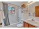 Clean bathroom featuring a bathtub, shower, and classic white tiling at 9590 S Warhawk Rd, Conifer, CO 80433