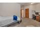 Neutral bedroom with a bed, desk, and plenty of closet space, great for relaxation and productivity at 9590 S Warhawk Rd, Conifer, CO 80433