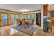 A well-lit dining area with large windows offering scenic outdoor views at 9590 S Warhawk Rd, Conifer, CO 80433