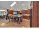 Chef's kitchen featuring a large island, wood cabinets, stainless steel appliances, and a skylight at 9590 S Warhawk Rd, Conifer, CO 80433