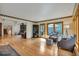 Cozy living room with comfortable seating and a view of the deck at 9590 S Warhawk Rd, Conifer, CO 80433