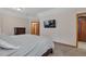 Large main bedroom featuring neutral colors and wood trim at 9590 S Warhawk Rd, Conifer, CO 80433