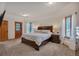 Spacious main bedroom with natural light and a door to the outside at 9590 S Warhawk Rd, Conifer, CO 80433