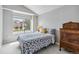 Comfortable bedroom featuring neutral tones, natural light, and stylish furnishings at 12551 W 84Th Cir, Arvada, CO 80005