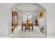 Elegant dining room featuring a classic wood table and chairs under a modern chandelier at 12551 W 84Th Cir, Arvada, CO 80005