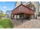 Exterior elevation highlighting the home's expansive deck, accessible from the backyard at 12551 W 84Th Cir, Arvada, CO 80005
