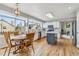 Bright kitchen and breakfast nook area boasting island and ample windows for natural light at 12551 W 84Th Cir, Arvada, CO 80005
