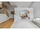 Bright living area with staircase, stylish furniture, and a dining room with views at 12551 W 84Th Cir, Arvada, CO 80005