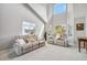Bright living room featuring high ceilings and comfortable seating area with plush sofa and windows at 12551 W 84Th Cir, Arvada, CO 80005