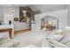 Open-concept living room features staircase and adjacent dining area at 12551 W 84Th Cir, Arvada, CO 80005