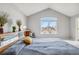 Bright main bedroom features vaulted ceilings, large windows, and comfortable furnishings at 12551 W 84Th Cir, Arvada, CO 80005