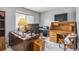 A quaint home office space with vintage wooden desk and drawers, and a window providing natural light at 12551 W 84Th Cir, Arvada, CO 80005